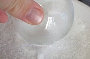 Dip an ornament in this mix of Mod Podge and Epsom salt to make your tree look magical