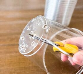 She pokes holes into plastic cups for a quicker way to make her plants healthy and happy