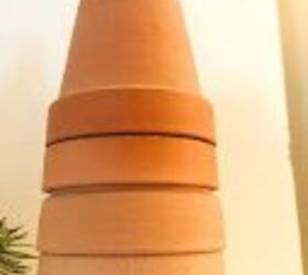 She stacks terracotta pots for this adorable Christmas idea