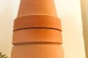 She stacks terracotta pots for this adorable Christmas idea