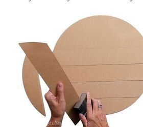 She sands the side of shiplap slabs for sweet outdoor decor