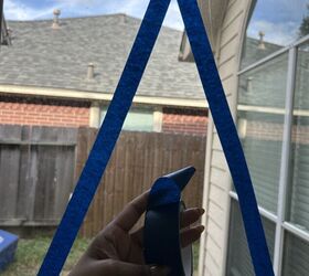 She puts 2 strips of tape on her window to add even more festive cheer to her home