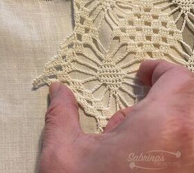 She puts an antique linen towel over her table runner to give it this elegantly nostalgic look