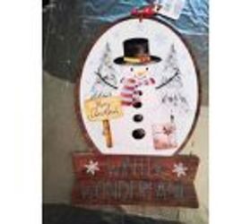 She transformed this Dollar Tree wall art into this idea that will get everyone really excited for Christmas