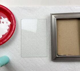 She glues a little glass tube to an old picture frame for one of the coolest wall art ideas we've seen in a while