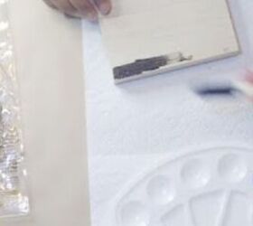 She paints 3 $1 wooden shadow boxes black to add a touch of charm to her home