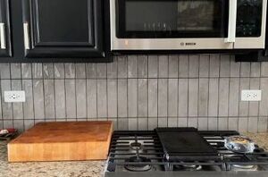These outlets were really messing up the vibes from her new backspash, so she came up with this clever and budget-friendly solution