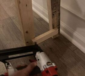 She attaches 2 pieces of wood for smart dining room storage