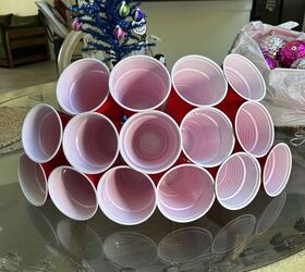 Layer each row carefully, overlapping cups to form a sturdy tree shape