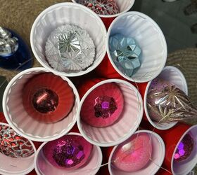 A cozy scarf or blanket sets the stage for your glowing plastic cup tree