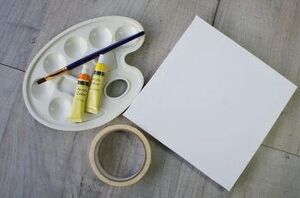 Put tape on a little canvas for this easy and impressive crafting idea