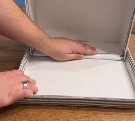 Slide each shoe box on its side into the upturned lid to form a shoe cubby.