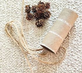 She wraps jute twine around an empty toilet paper roll for stunning table decor