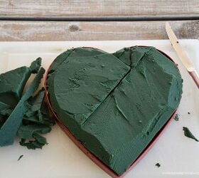 She stuffs floral foam into a heart-shaped tin for the lovliest tablescape for Valentine's Day