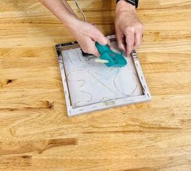 She glues fairy lights to Dollar Tree art for this magical Valentine's Day idea