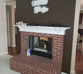 She did just the right thing to make this old fireplace look magazine-worthy