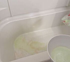 deep clean your shower floor, DIY cleaning solution coating a stained shower floor