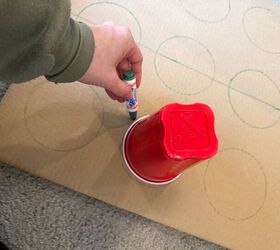 She traces Solo cups on a piece of cardboard for a party idea we can't wait to try