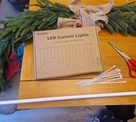 She was feeling nostalgic for Christmas, so she grabbed a tension rod and some curtain lights for this festive window decor idea