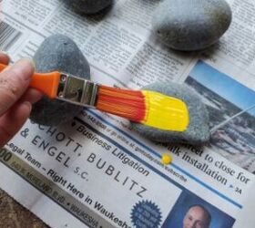 She paints a bunch of rocks yellow for this cute and thoughtful idea