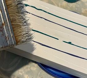 She painted some driftwood chunks for this organizing idea that's full of coastal vibes