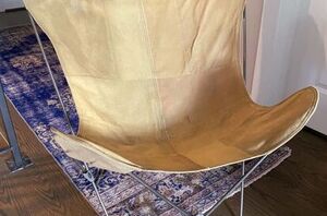 Instead of tossing this bland, old butterfly chair, she gave it SUCH a fun upgrade