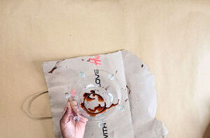 She drips alcohol and ink onto a glass Dollar Tree bowl for this super cool technique