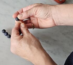 She strings beads on some wire for this custom tablescape idea