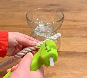 Adding nautical rope around the bottom bowl to create a coastal-style candle holder