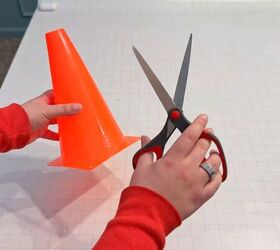 She cuts a little orange traffic cone for this incredible Easter idea