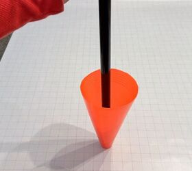 Cone with broom handle glued into the tip