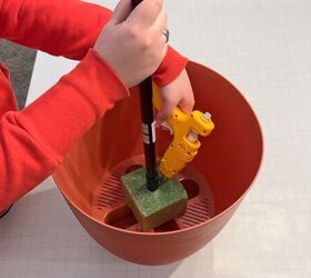DIY carrot decoration made with cone and broom handle