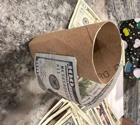 Stick dollar bills to an empty toilet paper roll for this super-fun gift idea