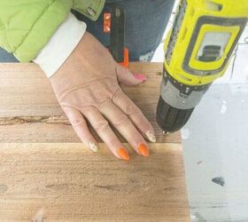 She drills a hole through a wooden plank for this impressive outdoor idea that's built to last