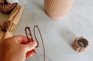 Bend raffia-wrapped wire like this to make your Easter table even MORE enchanting