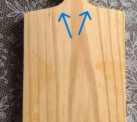 She sticks a denim pocket on a crooked cutting board for this adorable decor idea