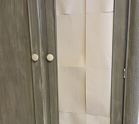 She taped sheets of paper to this masculine-looking armoire for this elegant and feminie makeover
