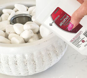 Pour rubbing alcohol into a ceramic pot to make summer nights more meorable