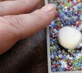 She presses balls of clay on a bunch of these tiny beads for this enchantingly easy crafting idea