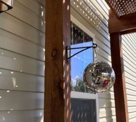 Disco ball hanging in sunlight to help deter flying bugs naturally