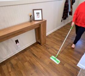 Cleaning floors with orange essential oil for a fresh scent and bug deterrent