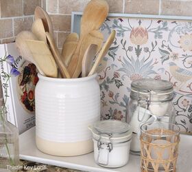 leftover wallpaper scraps turn them into this beautiful decorative bo, A wallpaper lined tray propped against the backsplash in the kitchen