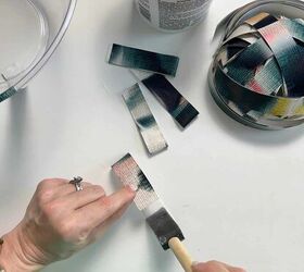 leftover wallpaper scraps turn them into this beautiful decorative bo, Applying wallpaper adhesive to leftover scrap strips and booking the paper