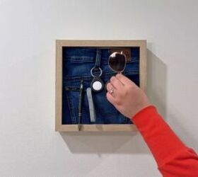 Transforming thrifted jeans into a DIY shadow box wall organizer with a functional pocket