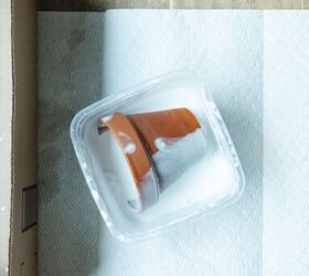 She dips mini terracotta pots into white paint for one of our FAVORITE summer outdoor accents