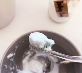 Stick a toothbrush in a bowl of baking soda and peroxide for this next level bathroom cleaning hack