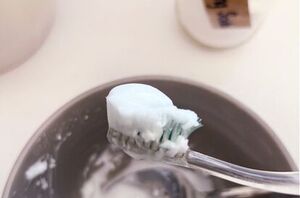 Stick a toothbrush in a bowl of baking soda and peroxide for this next level bathroom cleaning hack