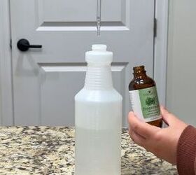 Homemade vinegar cleaning spray with essential oils for bedroom surfaces 