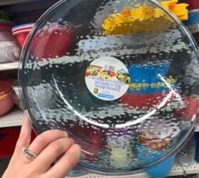 She puts a dollar store serving bowl on her ceiling for one of the smartest tricks we've seen in a while