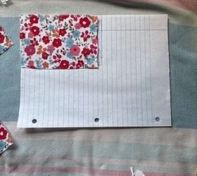 She puts a square fabric scrap on a piece of lined paper for an adorable and patriotic idea